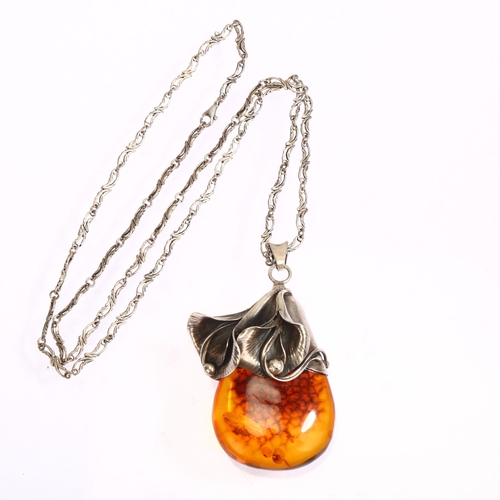 1307 - A large amber and silver flower drop design pendant and chain, pendant length excluding bale 58mm, 5... 