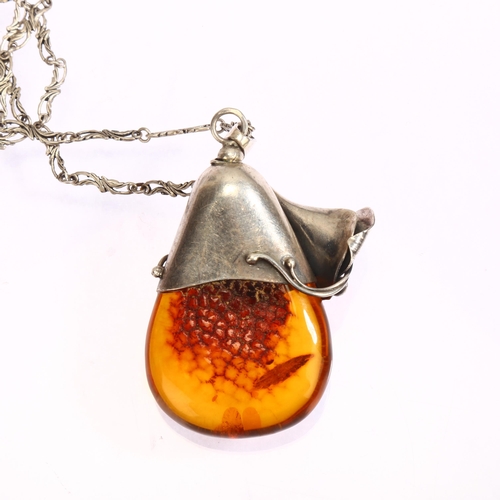 1307 - A large amber and silver flower drop design pendant and chain, pendant length excluding bale 58mm, 5... 