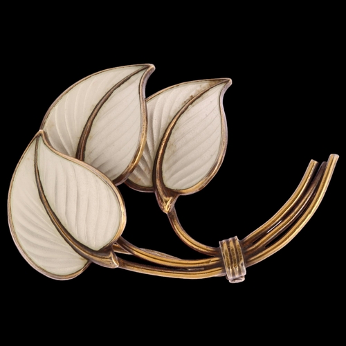 1328 - A Norwegian sterling silver-gilt and white enamel triple leaf design brooch, length 42mm, 7.8g