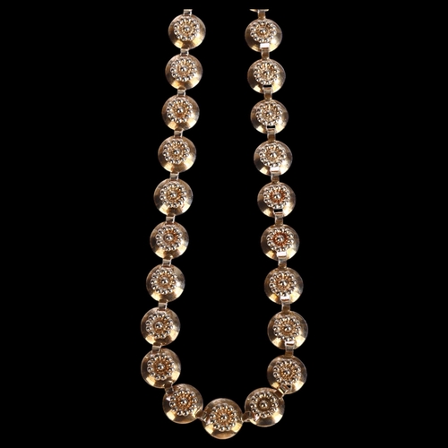 1334 - HERMANN SIERSBOL - a sterling silver necklace with floral shield decoration, length 39cm, 24.5g