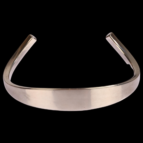 1337 - FRANK AHM - a Danish modernist sterling silver plain form cuff bangle, model no. 580, setting height... 