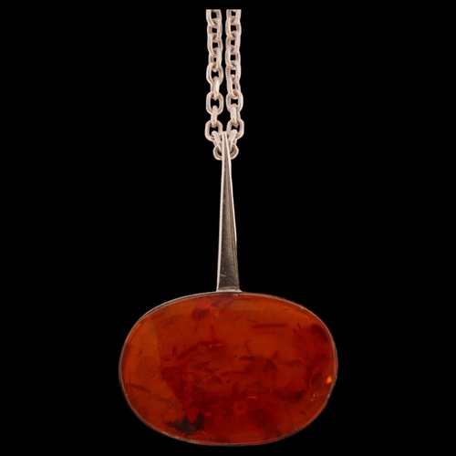 1345 - N E FROM - a Danish sterling silver amber set abstract pendant on silver chain, pendant length 55mm,... 