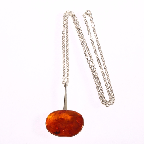 1345 - N E FROM - a Danish sterling silver amber set abstract pendant on silver chain, pendant length 55mm,... 