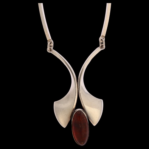 1346 - N E FROM - a Danish sterling silver pendant necklace, set with a central amber stone, length 49cm