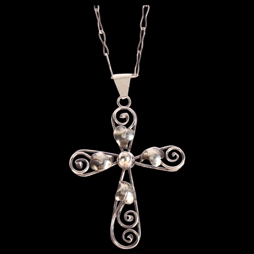 1362 - A silver leaf and scroll design cross pendant on silver chain, cross height excluding bale 55mm, 9g