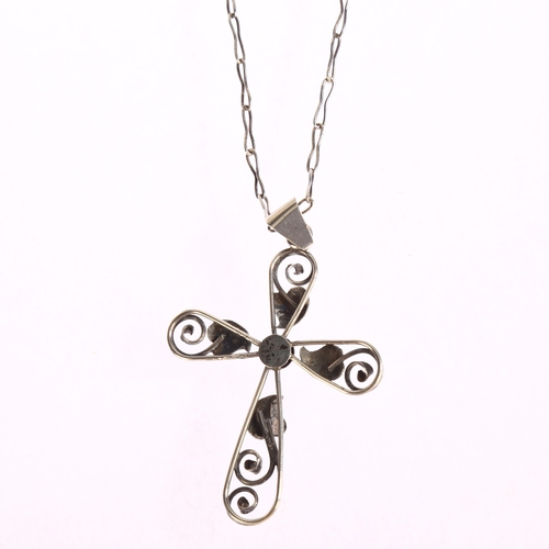 1362 - A silver leaf and scroll design cross pendant on silver chain, cross height excluding bale 55mm, 9g