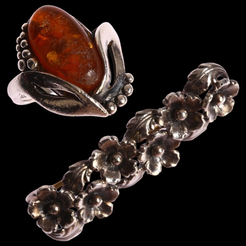 1377 - N E FROM - a Danish sterling silver and amber ring, and a sterling silver floral design brooch, leng... 