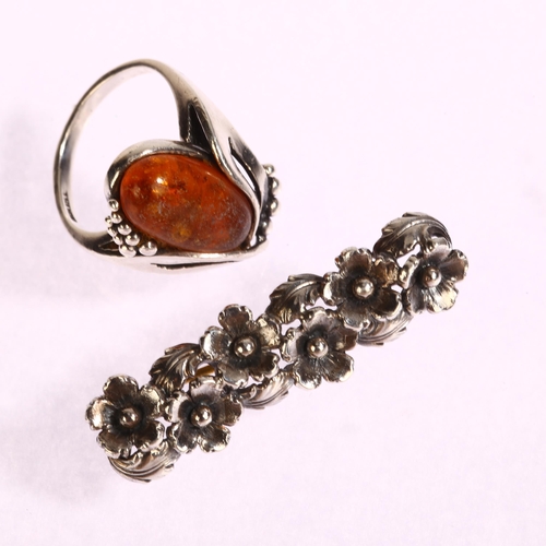 1377 - N E FROM - a Danish sterling silver and amber ring, and a sterling silver floral design brooch, leng... 