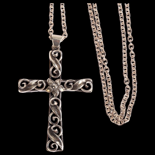 1380 - LARS BRAEMER-JENSEN - an ornate silver scroll design cross pendant on sterling silver chain, cross l... 