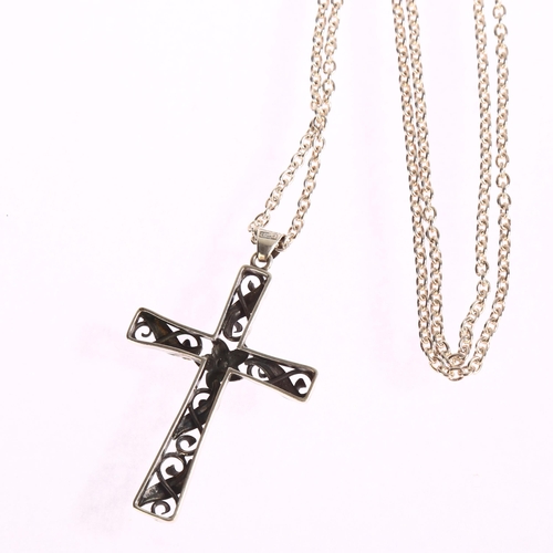 1380 - LARS BRAEMER-JENSEN - an ornate silver scroll design cross pendant on sterling silver chain, cross l... 