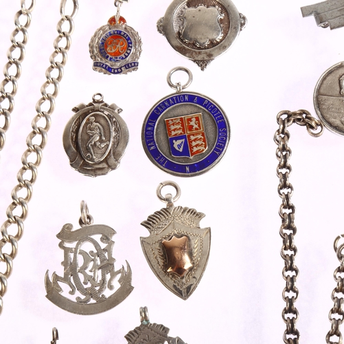 1386 - A mixed group of items, including 2 silver fob chains, 9 various silver and enamel fobs and brooches... 