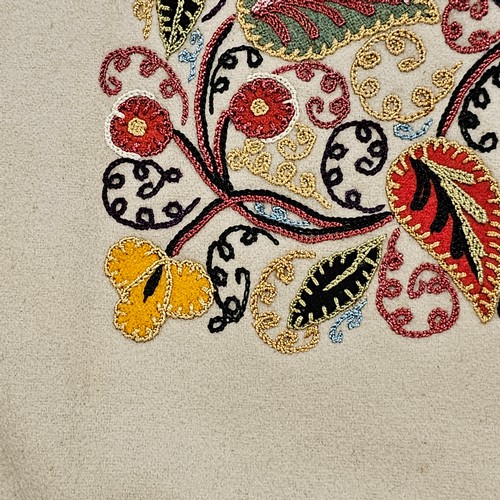 118 - 2 early 20th century crewel embroidered panels, 58cm across, 1 with a rope border, the other mounted... 