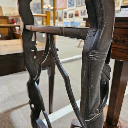 199 - A Chinese 19th century rosewood altar table, with grapevine carved and pierced frieze on carved supp... 