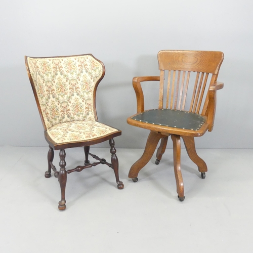 2715 - An antique oak captain's swivel desk chair and a mahogany and upholstered wingback side chair (2).