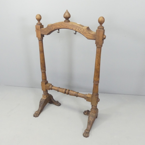 2718 - An eastern oak gong stand. 70x114x36cm.