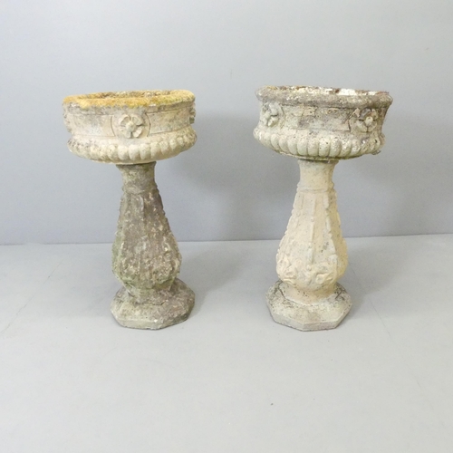 2722 - A pair of weathered concrete two-section planters on stands.  40x72cm.