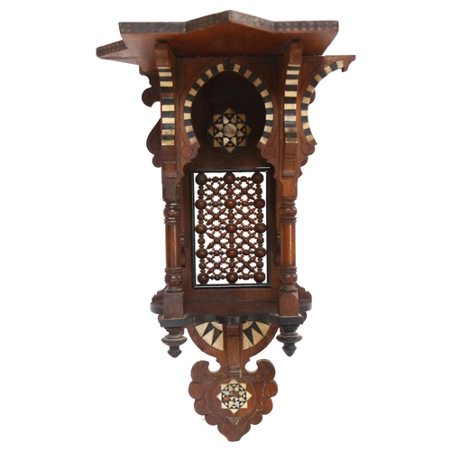 106 - A Moorish designed carved wood hanging shrine, with bone and ebony inset decoration, L48cm