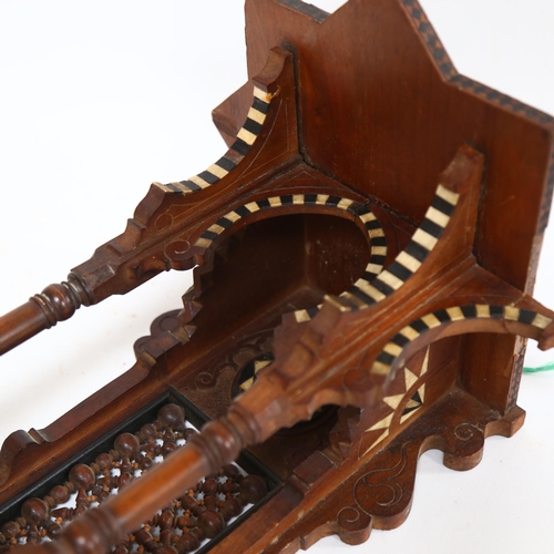 106 - A Moorish designed carved wood hanging shrine, with bone and ebony inset decoration, L48cm