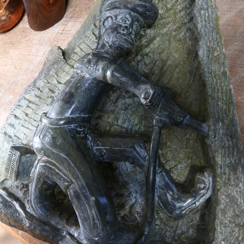 11 - A hand carved green serpentine sculpture, depicting a miner, H46cm (AF)