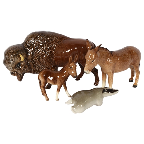 111 - A group of 3 Beswick animals, including a bison, a donkey, and a foal, and a Russian badger