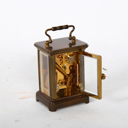 117 - A miniature brass-cased carriage clock, back of the movement engraved N Norman London 1742, height n... 