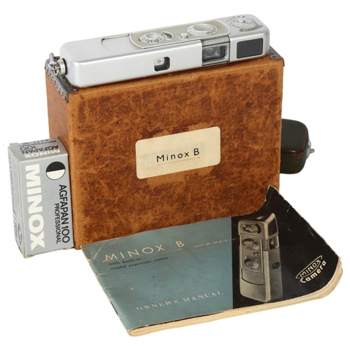 129 - A Minox B Spy camera, original green leather case and chain, instructions and boxed film