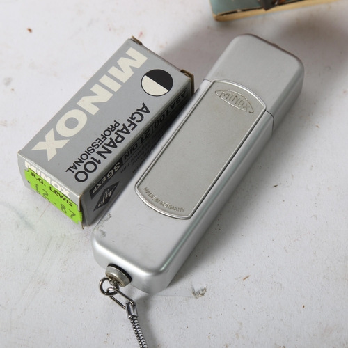 129 - A Minox B Spy camera, original green leather case and chain, instructions and boxed film