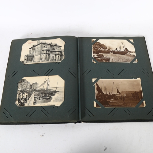 134 - An album of early black and white and coloured postcards, depicting Hastings and St Leonards, includ... 