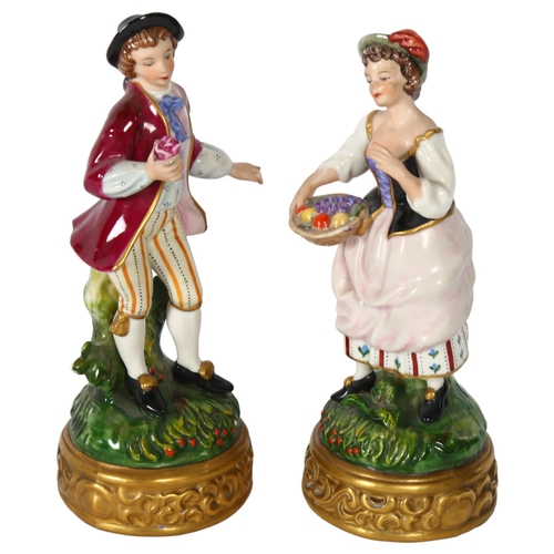 138 - A pair of German porcelain figures, a lady with a basket of fruit, and a man with a rose