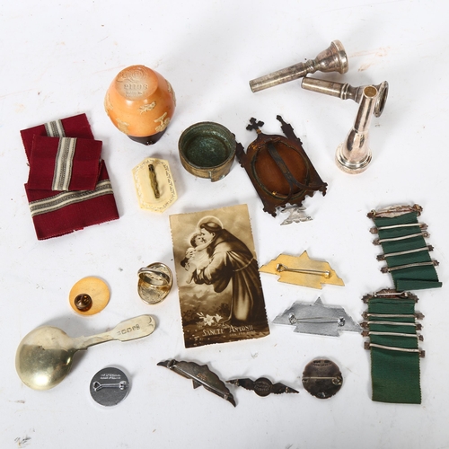 141 - A group of various items, including a miniature Doulton jug, a silver nurse's badge, Pratt's bronze ... 