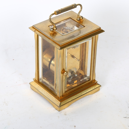 152 - JENS OLSEN - a brass-cased carriage clock, height not including handle 11cm