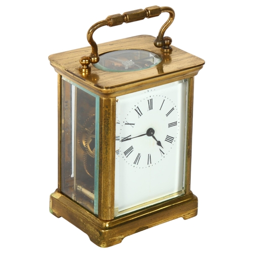 153 - A brass-cased carriage clock, enamel dial and Roman numerals, case height not including handle 10.5c... 