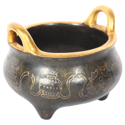 160 - A Chinese bronze 2-handled censer, with gold engraved decoration and character mark to the base, H9.... 