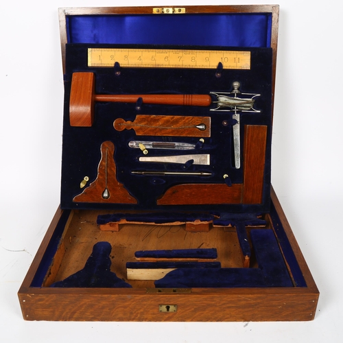 26 - A cased set of working tools, reportedly from a Masonic Lodge circa 1929, case width 42cm