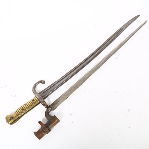 55 - A 19th century French bayonet, serial no. 50130 (worn), overall length 69cm, together with an Englis... 