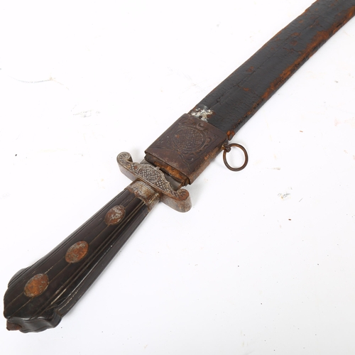 56 - An Indo-Persian short curved sword with steel guard and carved wood handle, together with leather sc... 