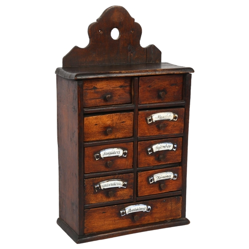 82 - A small Continental stained wood hanging spice chest, with 9 short drawers and ceramic plaques,18 x ... 