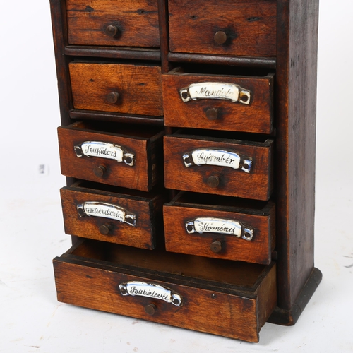 82 - A small Continental stained wood hanging spice chest, with 9 short drawers and ceramic plaques,18 x ... 