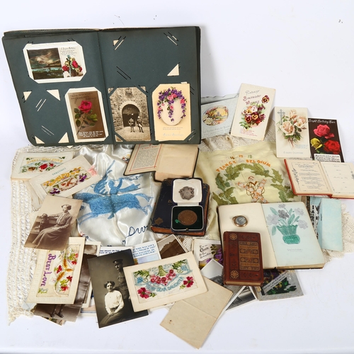 86 - An early 20th century postcard album, various subjects including motoring, family and military, an i... 