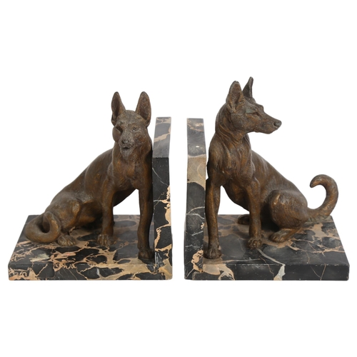 184 - A pair of German Shepherd dog sculptural spelter bookends, on marble bases, H18cm, L15cm, D11cm (of ... 