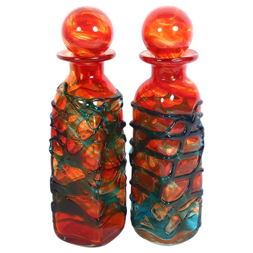 199 - 2 orange Mdina glass bottle vases and stoppers, with trailed decoration, both signed Mdina to base, ... 