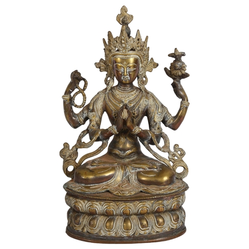 203 - A bronze Tibetan Buddha, on lotus leaf stand, H36cm