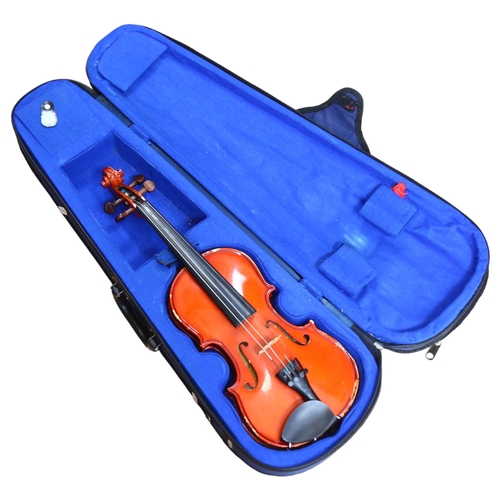 236 - A half-size violin, with label reading 