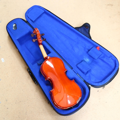 236 - A half-size violin, with label reading 