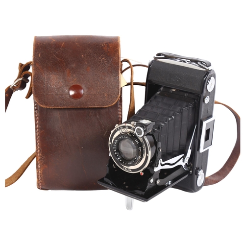 254 - A Zeiss Ikon Telma folding camera, with associated leather carry case, carry case has ref. 0355 stam... 