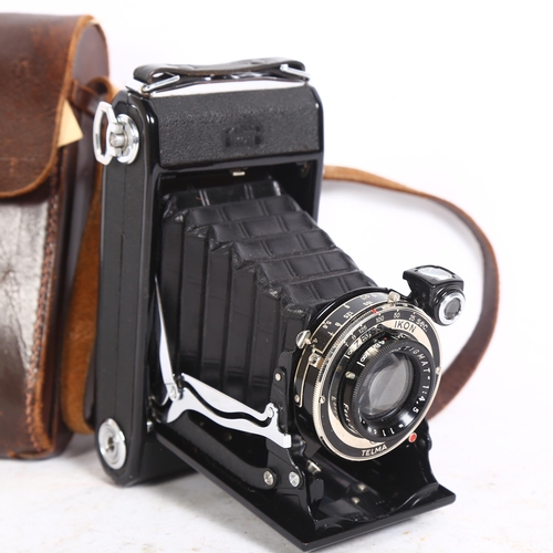 254 - A Zeiss Ikon Telma folding camera, with associated leather carry case, carry case has ref. 0355 stam... 