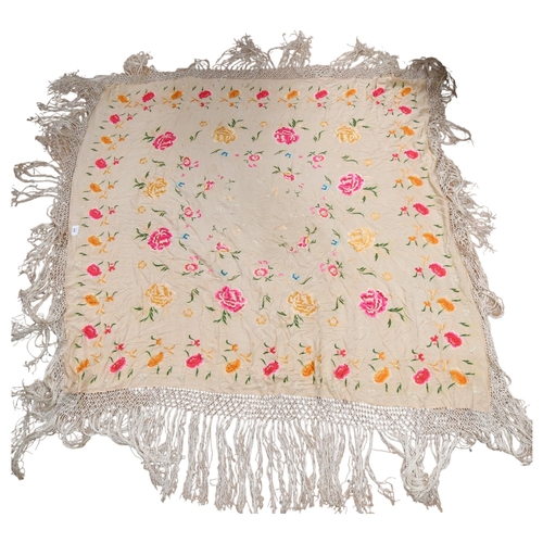 269 - A silk hand-stitched shawl, with floral decoration and frilled outer edge, 125 x 115cm