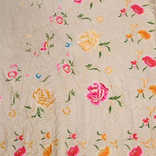 269 - A silk hand-stitched shawl, with floral decoration and frilled outer edge, 125 x 115cm