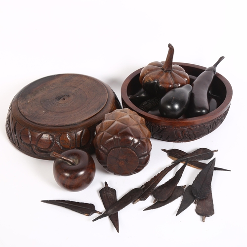 323 - 2 similar carved wood fruit bowls, with associated carved wooden fruit, 1 bowl decorated with animal... 