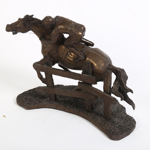 341 - A spelter sculpture of a jockey on horseback in galloping pose, H25cm